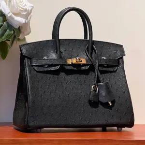 KELLY SELLIER 25 BAG IN BLACK OSTRICH LEATHER WITH GOLD HARDWARE